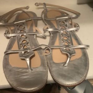 Loved but still have a lot of life in there! Silver Coach sandals.